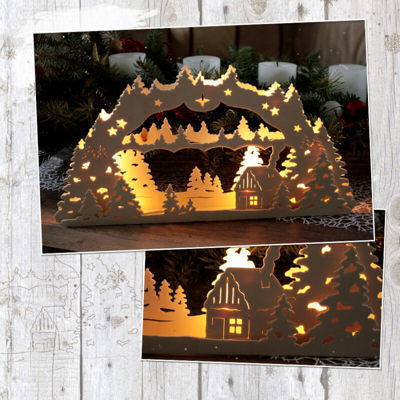 Abgebildet ist der Lichterbogen "Winterwald". Er wurde aus Sperrholz gefertigt und mit einer Lichterkette bestückt. Das Motiv des Schwibbogen zeigt ein kleines Haus inmitten einer Winterlandschaft.